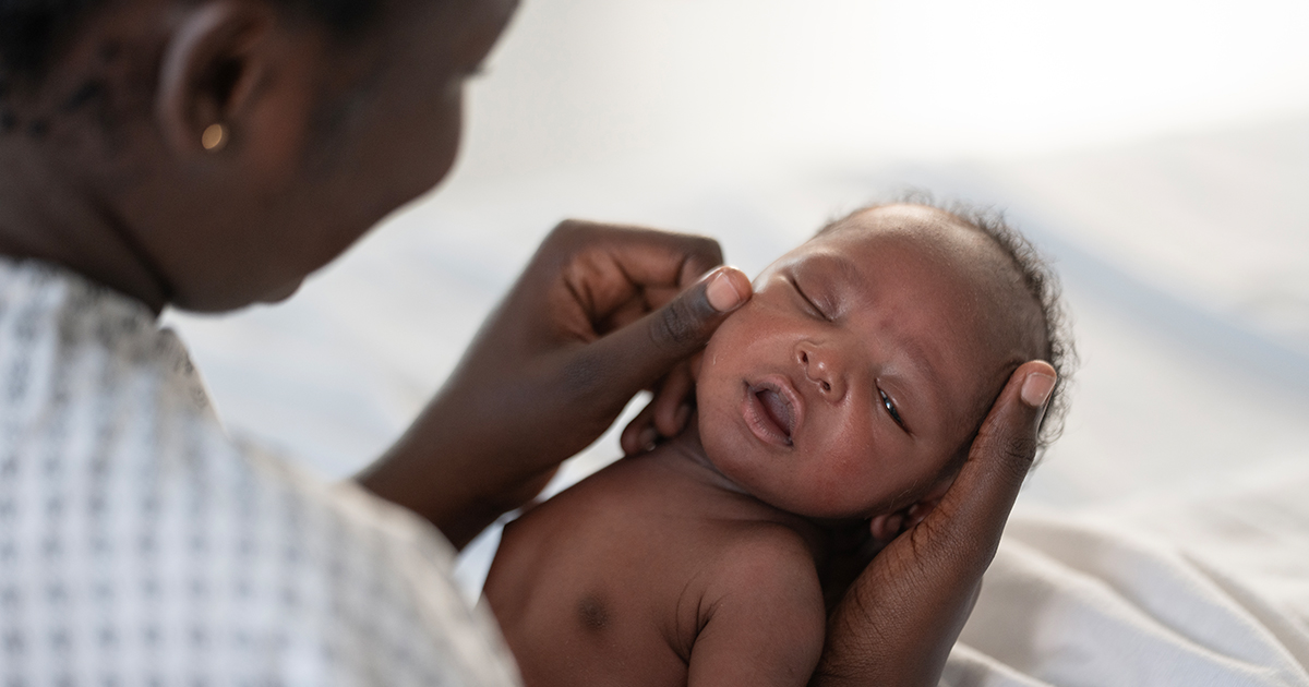 Mother holding newborn boy