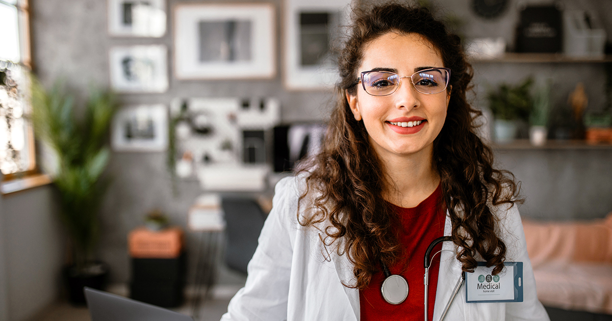 woman smiling labcoat