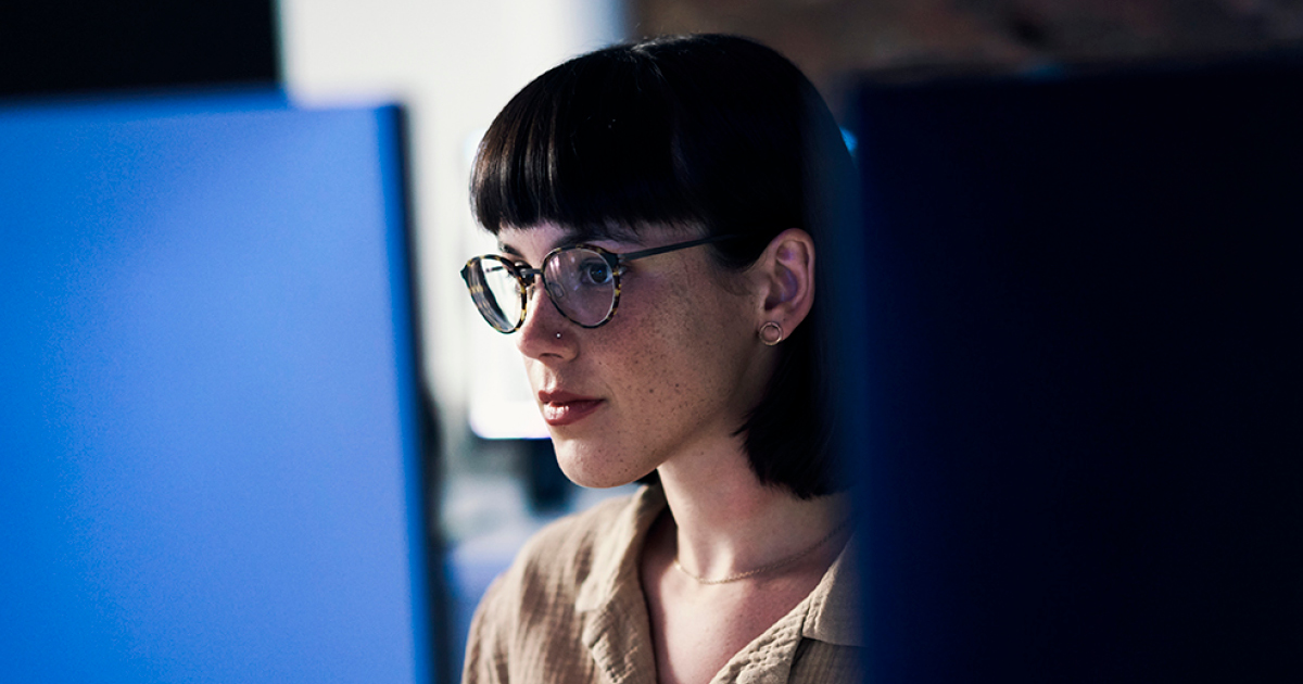 cybersecurity student at a computer
