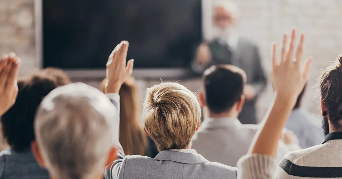 facing_instructor_hands_raised